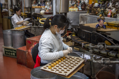 Golden Gate Fortune Cookie Factory in Chinatown, San Francisco, making fortune cookies daily.