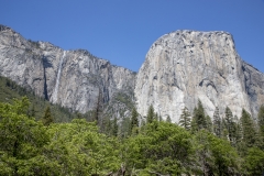 Spring landscape of Yosemite Valley with waterfalls, trees, and granite cliffs in California. Ribbon Falls in Yosemite Valley