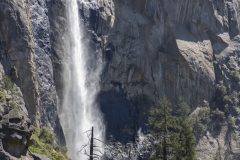 Spring landscape of Yosemite Valley with waterfalls, trees, and granite cliffs in California. Bridalveil Falls in Yosemite Valley