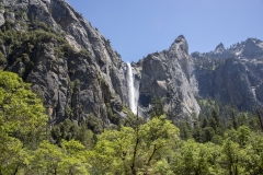 Spring landscape of Yosemite Valley with waterfalls, trees, and granite cliffs in California. 