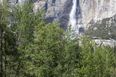 Spring landscape of Yosemite Valley with waterfalls, trees, and granite cliffs in California. 