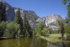 Spring landscape of Yosemite Valley with waterfalls, trees, and granite cliffs in California. 