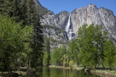 Spring landscape of Yosemite Valley with waterfalls, trees, and granite cliffs in California. 