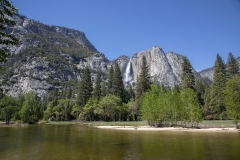 Spring landscape of Yosemite Valley with waterfalls, trees, and granite cliffs in California. 