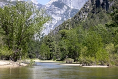 Spring landscape of Yosemite Valley with waterfalls, trees, and granite cliffs in California. Spring landscape of Yosemite Valley with waterfalls, trees, and granite cliffs in California.