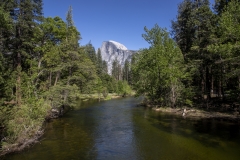 Spring landscape of Yosemite Valley with waterfalls, trees, and granite cliffs in California. 