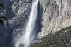 Spring landscape of Yosemite Valley with waterfalls, trees, and granite cliffs in California. 