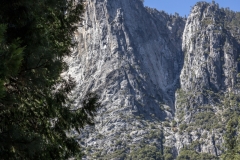 Spring landscape of Yosemite Valley with waterfalls, trees, and granite cliffs in California.