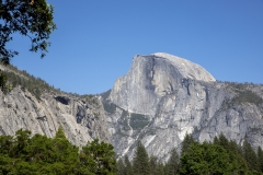 Spring landscape of Yosemite Valley with waterfalls, trees, and granite cliffs in California.