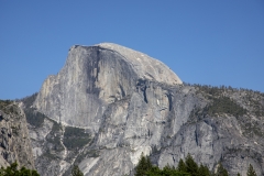 Spring landscape of Yosemite Valley with waterfalls, trees, and granite cliffs in California.