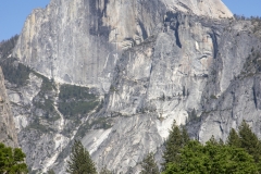 Spring landscape of Yosemite Valley with waterfalls, trees, and granite cliffs in California.