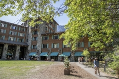 The Ahwahnee Hotel in Yosemite Valley surrounded by trees and mountains in the Sierra Nevada.