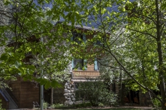 The Ahwahnee Hotel in Yosemite Valley surrounded by trees and mountains in the Sierra Nevada.