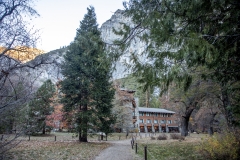 The Ahwahnee Hotel in Yosemite Valley surrounded by trees and mountains in the Sierra Nevada.