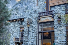 The Ahwahnee Hotel in Yosemite Valley surrounded by trees and mountains in the Sierra Nevada.