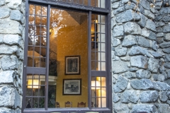 The Ahwahnee Hotel in Yosemite Valley surrounded by trees and mountains in the Sierra Nevada.