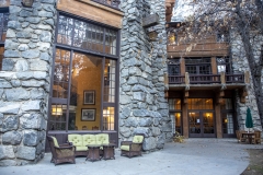 The Ahwahnee Hotel in Yosemite Valley surrounded by trees and mountains in the Sierra Nevada.