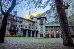 The Ahwahnee Hotel in Yosemite Valley surrounded by trees and mountains in the Sierra Nevada. The Ahwahnee Hotel in Yosemite Valley surrounded by trees and mountains in the Sierra Nevada.