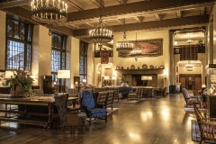 The Ahwahnee Hotel in Yosemite Valley surrounded by trees and mountains in the Sierra Nevada.